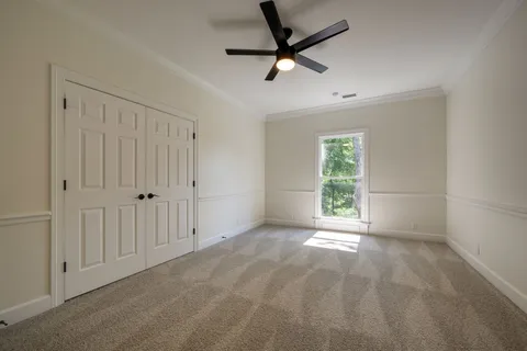 a view of a room with wooden floors