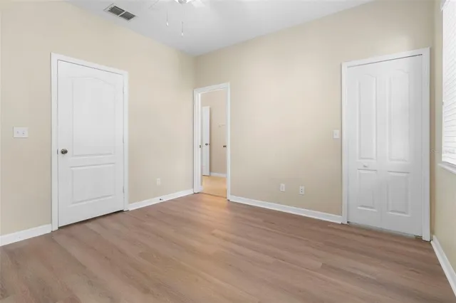 a bathroom with a granite countertop sink