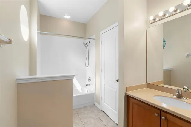 a bedroom with a bed and the view of bathroom