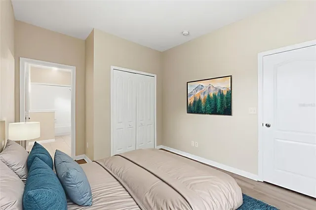 a bathroom with a sink a toilet a mirror and shower