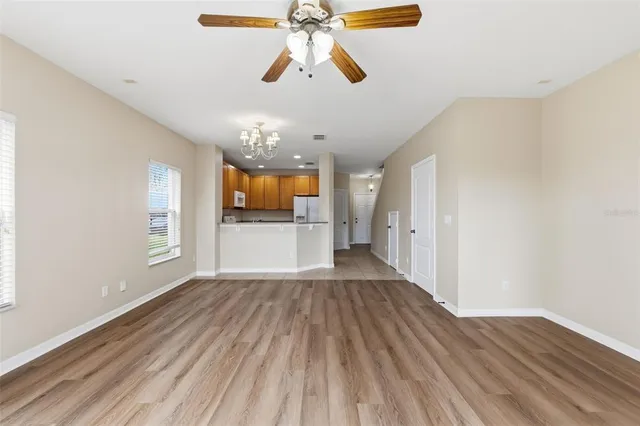 a kitchen with a sink and chandelier