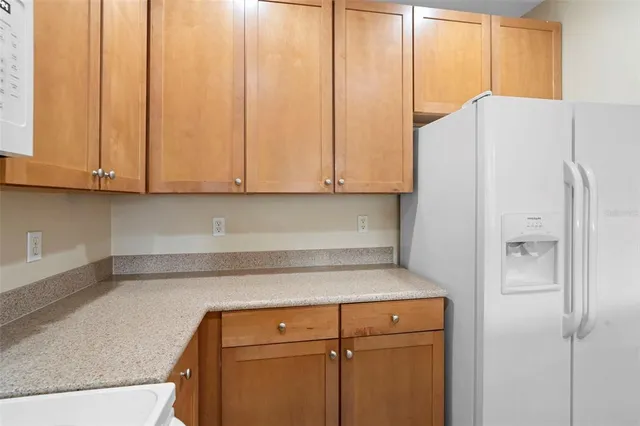 a kitchen with a stove a sink and a microwave