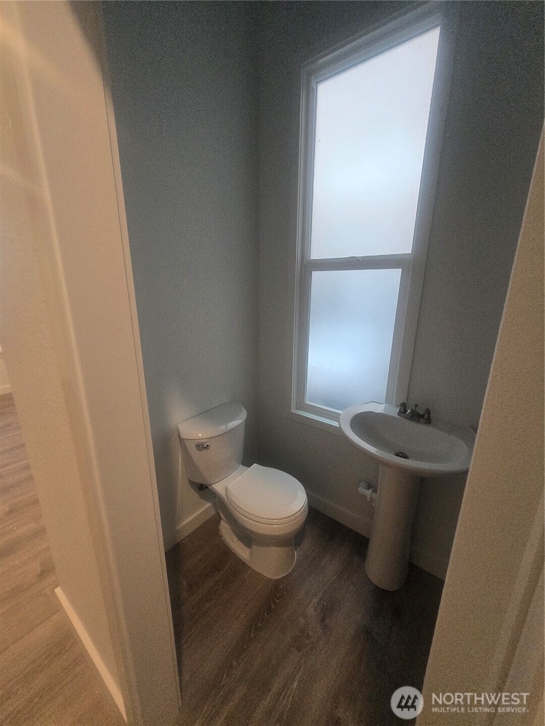 4332 University Way Northeast, Unit A Seattle, WA 98105 - Photo 9 of 20 a white toilet sitting next to a window