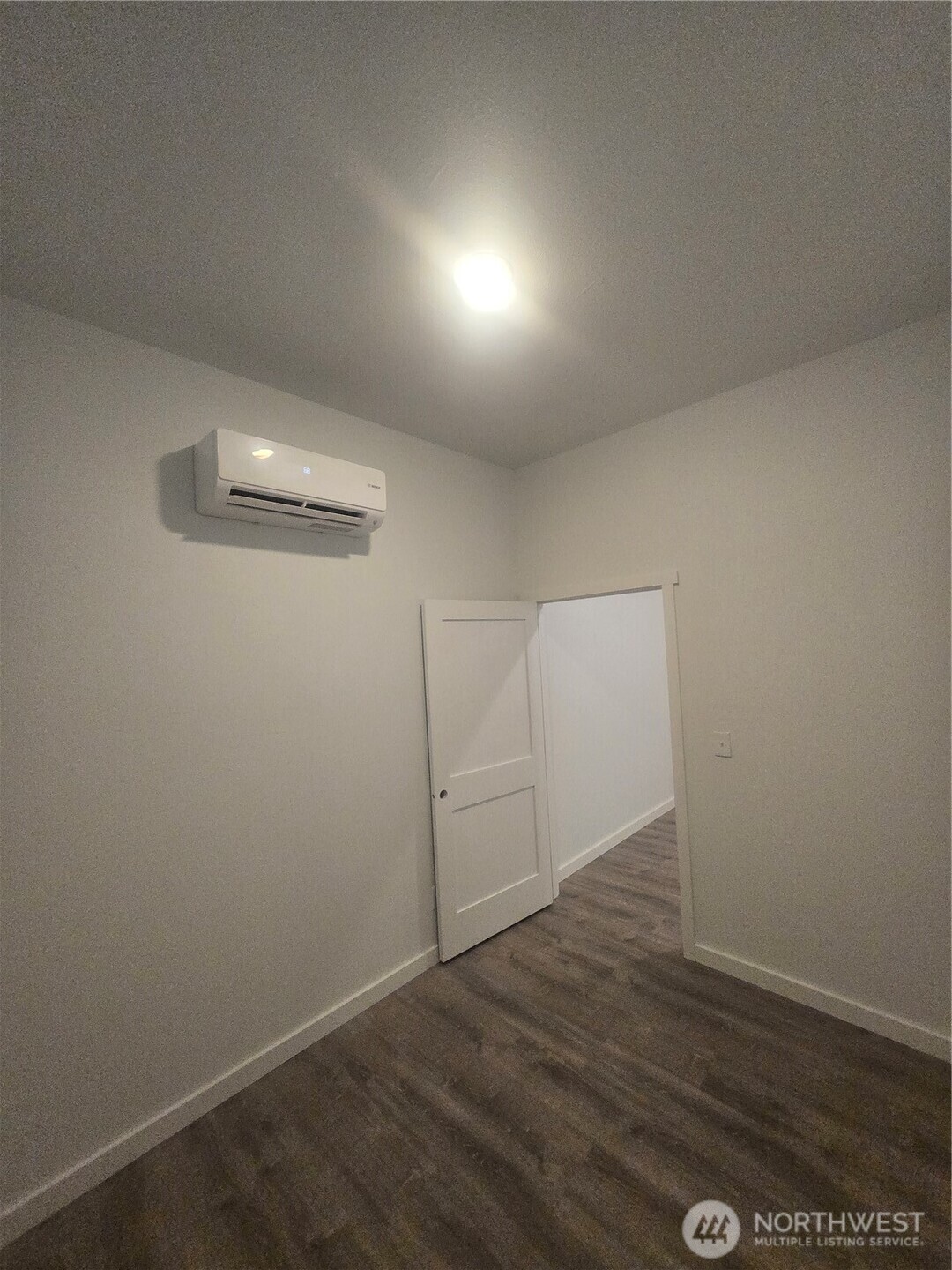 4332 University Way Northeast, Unit A Seattle, WA 98105 - Photo 10 of 20 an empty room with wooden floor and cabinet