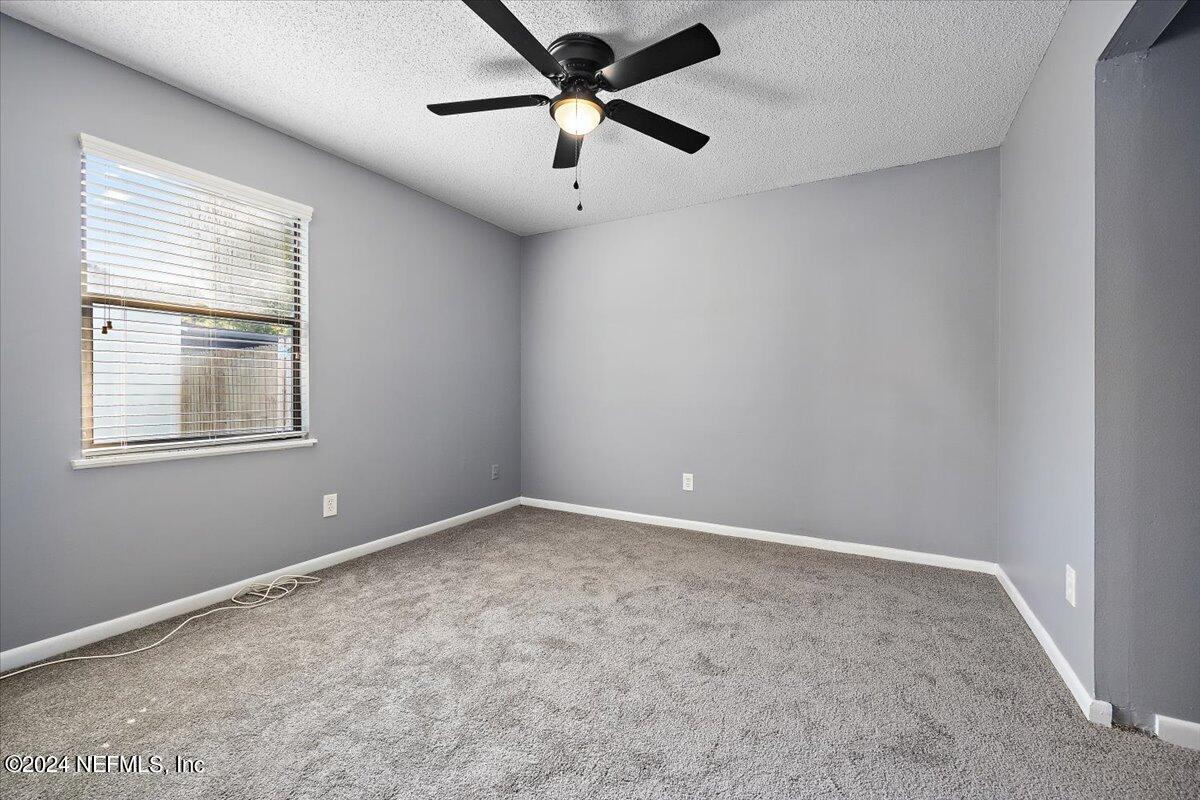 3176 Ricky Drive Jacksonville, FL 32223 - Photo 14 of 22 a view of an empty room with a window