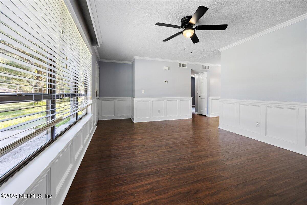 3176 Ricky Drive Jacksonville, FL 32223 - Photo 4 of 22 a view of empty room with wooden floor and fan