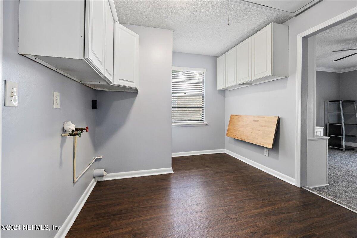 3176 Ricky Drive Jacksonville, FL 32223 - Photo 8 of 22 a view of a room with wooden floor and staircase