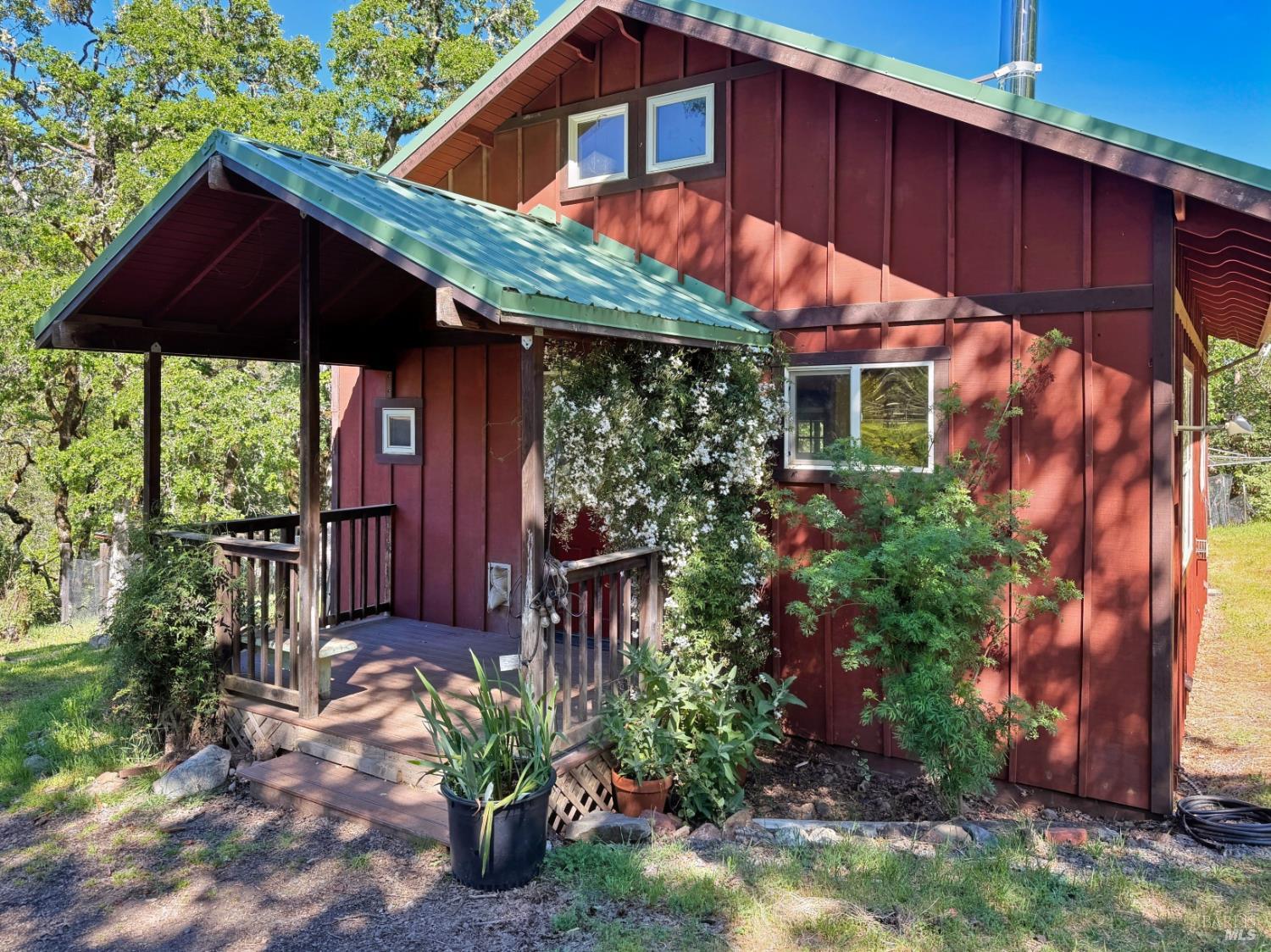 2501 Main Ranch Road Redwood Valley, CA 95470 - Photo 3 of 57 a view of a backyard with plants