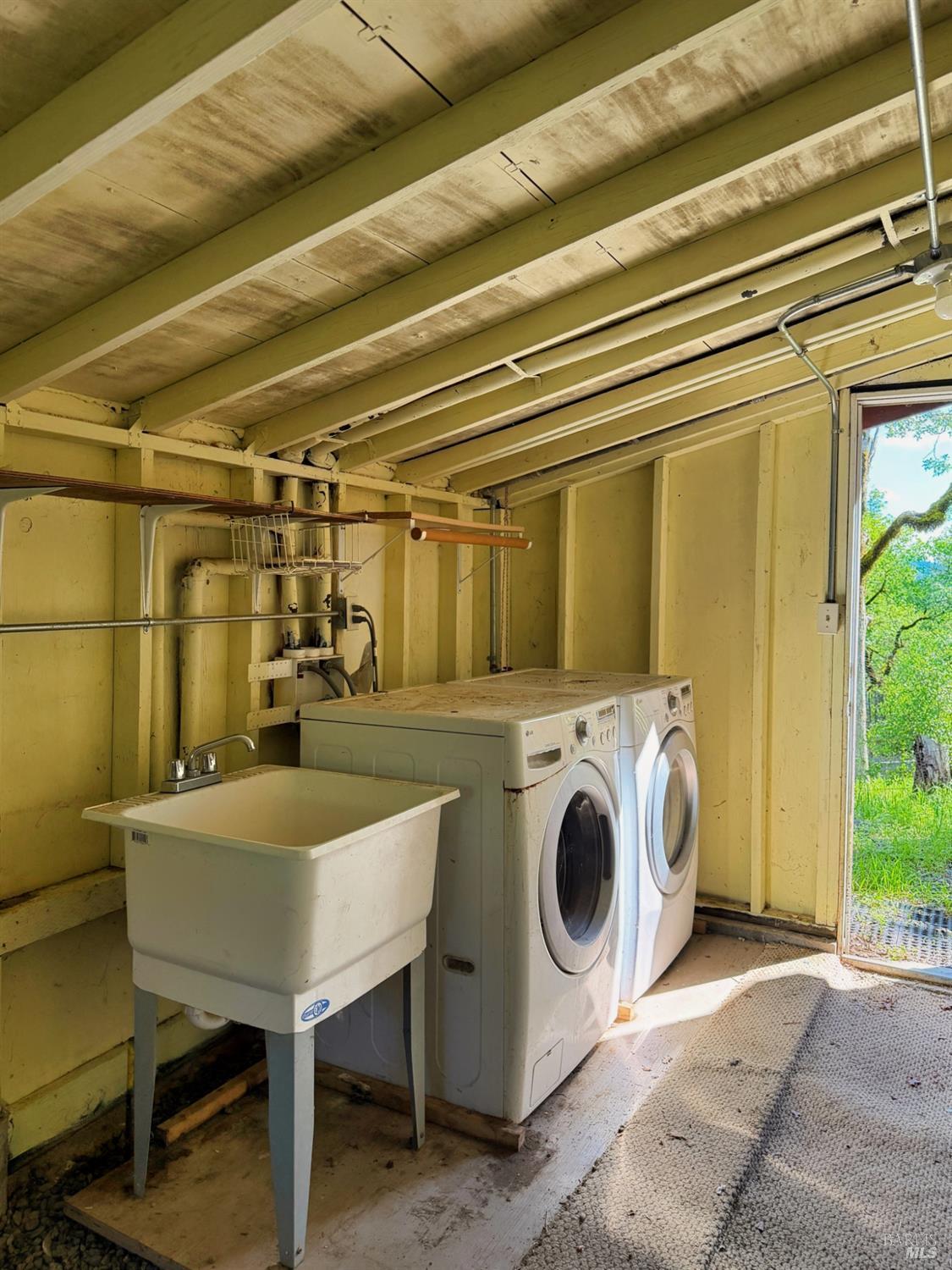 2501 Main Ranch Road Redwood Valley, CA 95470 - Photo 45 of 57 a view of a storage and utility room with a washer and dryer