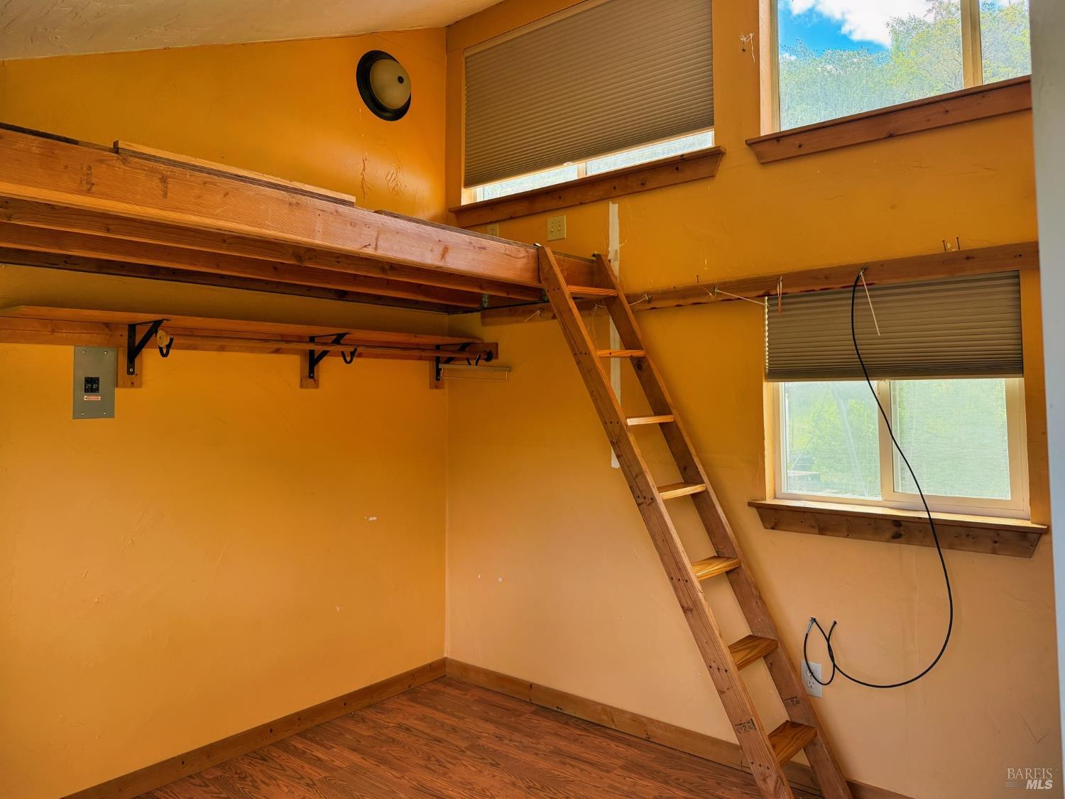 2501 Main Ranch Road Redwood Valley, CA 95470 - Photo 55 of 57 a view of a room with wooden floor and windows