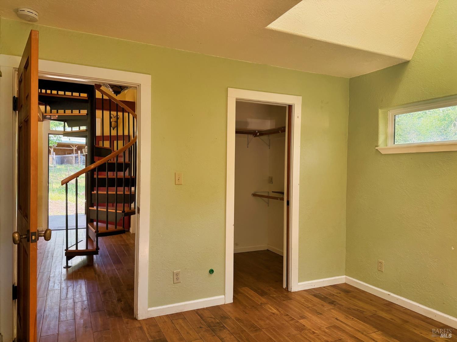 2501 Main Ranch Road Redwood Valley, CA 95470 - Photo 6 of 57 a view of a hallway with wooden floor and closet