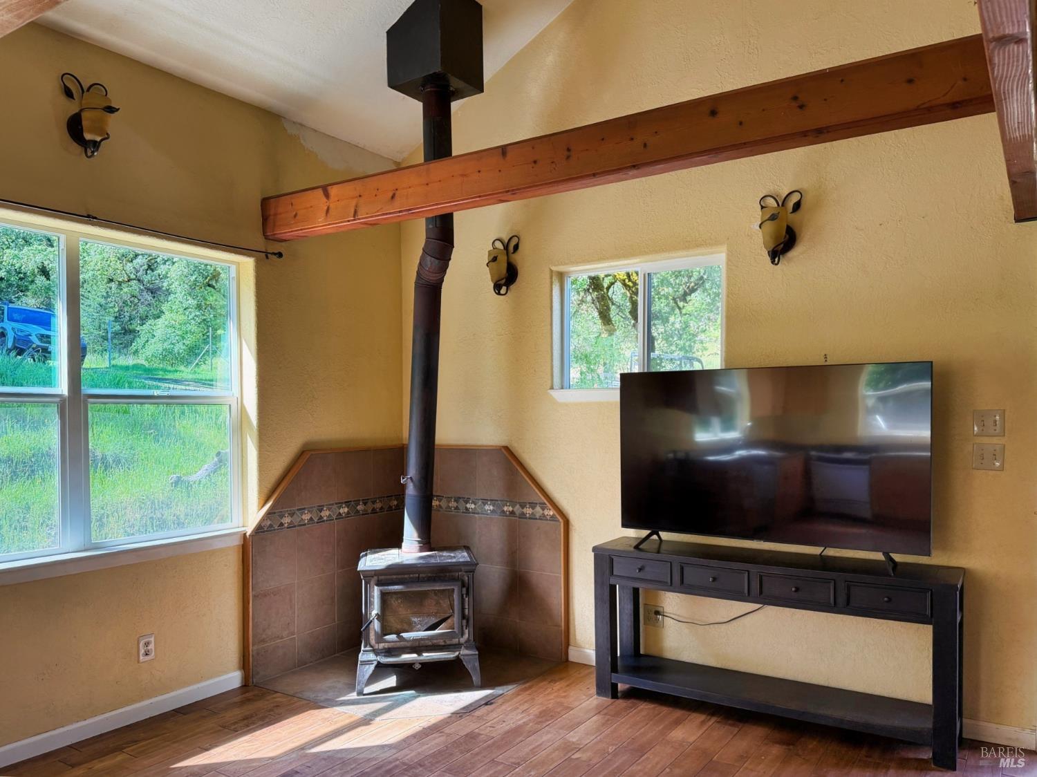 2501 Main Ranch Road Redwood Valley, CA 95470 - Photo 7 of 57 a living room with furniture and a flat screen tv
