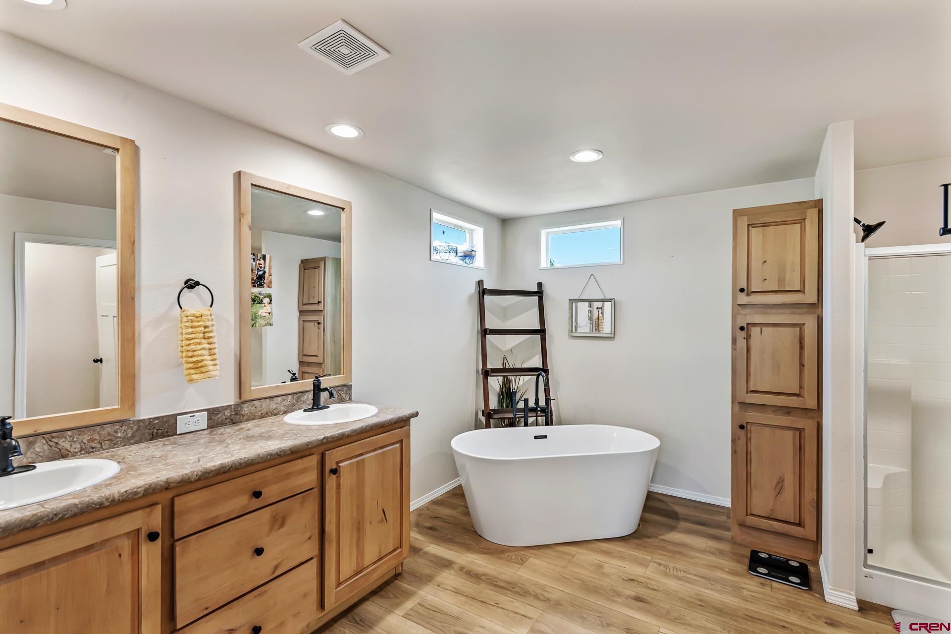 901 6530 Road, Unit 3007 Montrose, CO 81401 - Photo 18 of 33 a bathroom with a granite countertop sink and a mirror