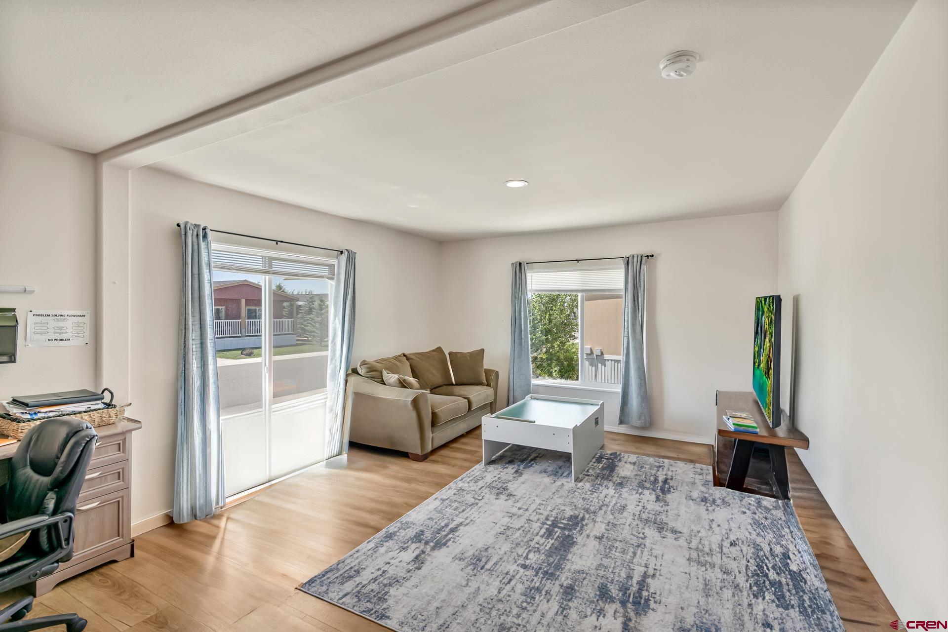901 6530 Road, Unit 3007 Montrose, CO 81401 - Photo 26 of 33 a living room with furniture and a couch