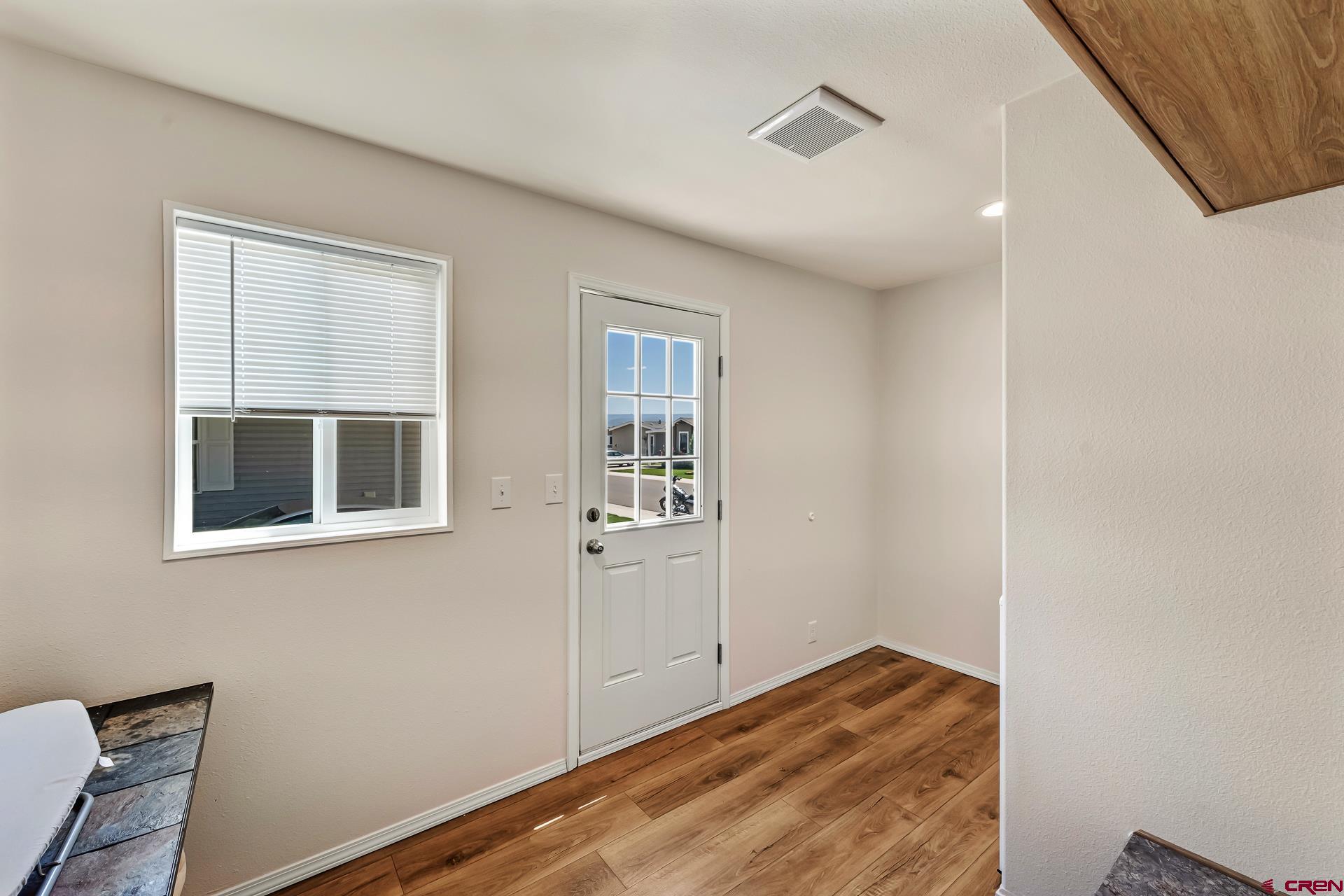 901 6530 Road, Unit 3007 Montrose, CO 81401 - Photo 28 of 33 a view of a livingroom with wooden floor and a window
