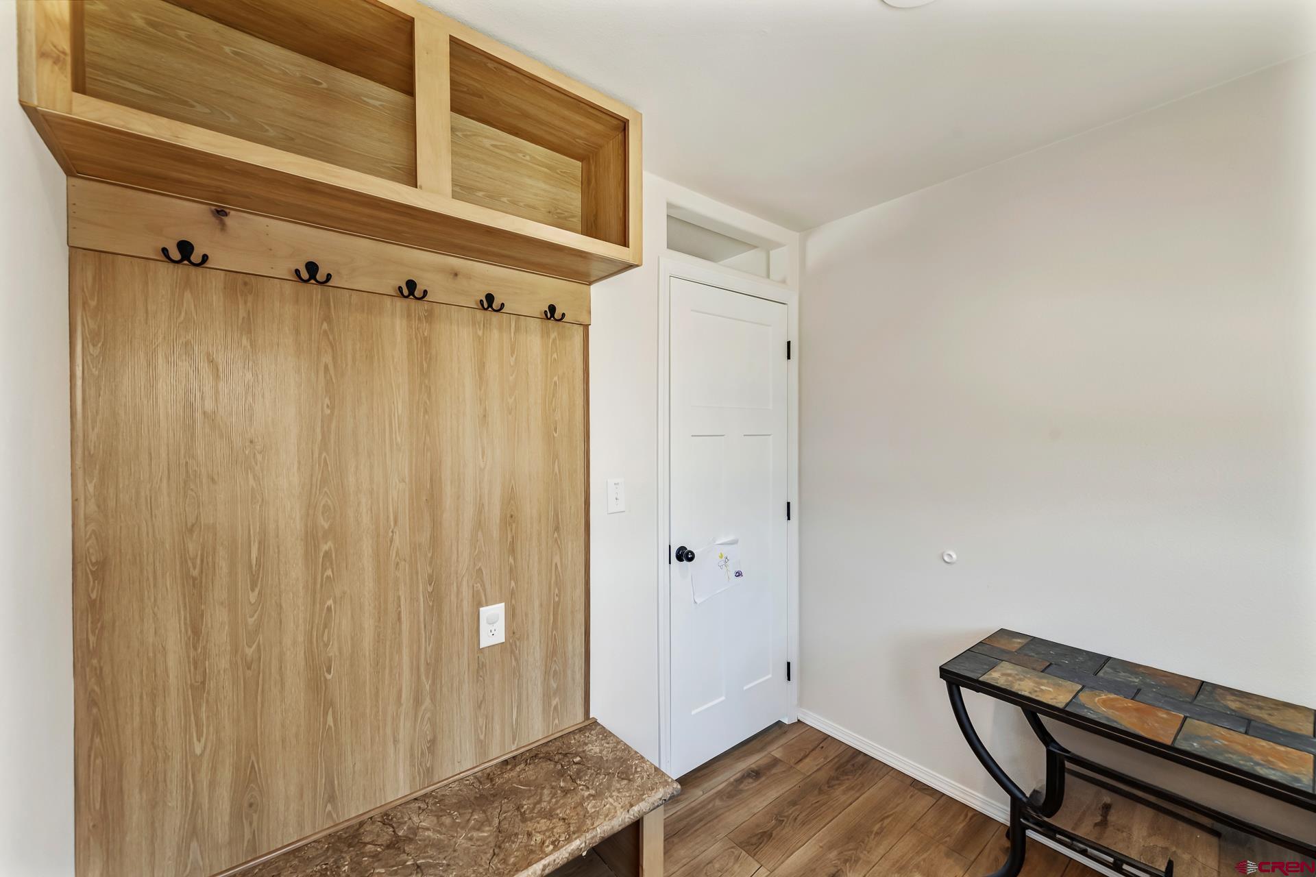 901 6530 Road, Unit 3007 Montrose, CO 81401 - Photo 30 of 33 a view of room with wooden floor and bathroom