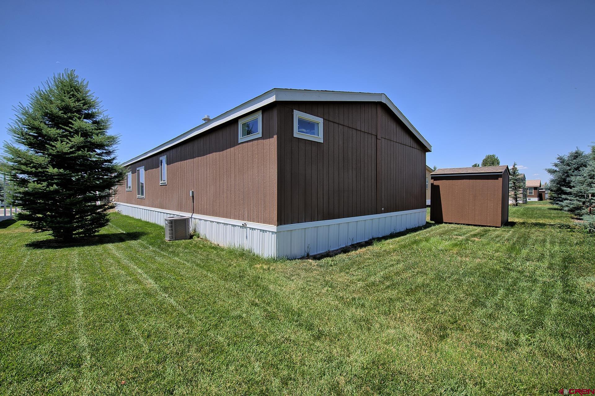901 6530 Road, Unit 3007 Montrose, CO 81401 - Photo 32 of 33 a view of a house with backyard