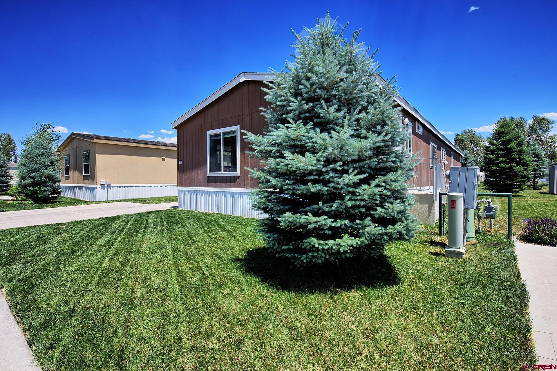 901 6530 Road, Unit 3007 Montrose, CO 81401 - Photo 33 of 33 a house view with a garden space