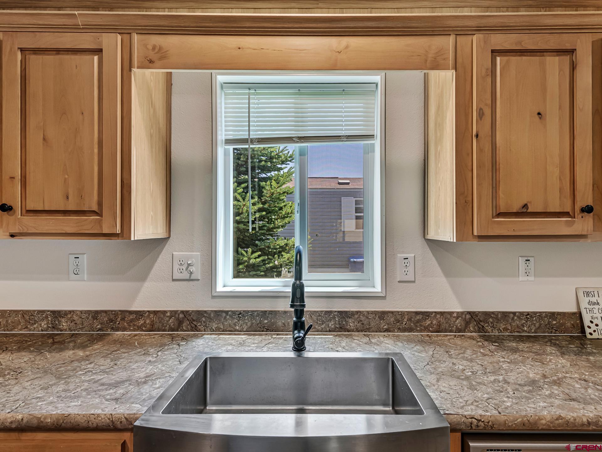 901 6530 Road, Unit 3007 Montrose, CO 81401 - Photo 10 of 33 a kitchen with granite countertop a sink and a window