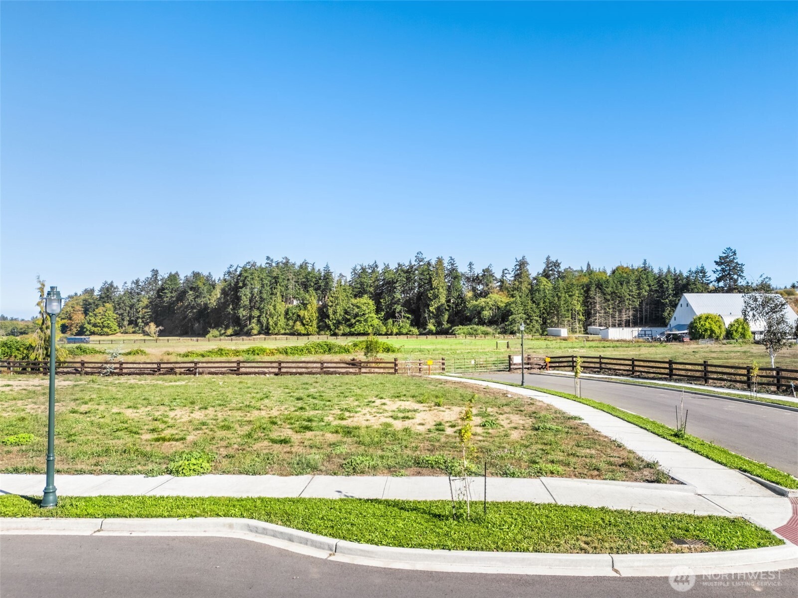 51 Colchester Street Sequim, WA 98382 - Photo 6 of 26 a view of a swimming pool with a yard