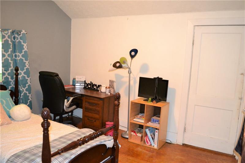 408 Cascade Road Pittsburgh, PA 15221 - Photo 23 of 25 FOURTH BEDROOM/2nd floor: This fourth bedroom leads to the large master bedroom, added by the sellers in 2007. This bedroom could easily be converted into a master bathroom for the huge added master, or could be made into a dressing room or second floor laundry!