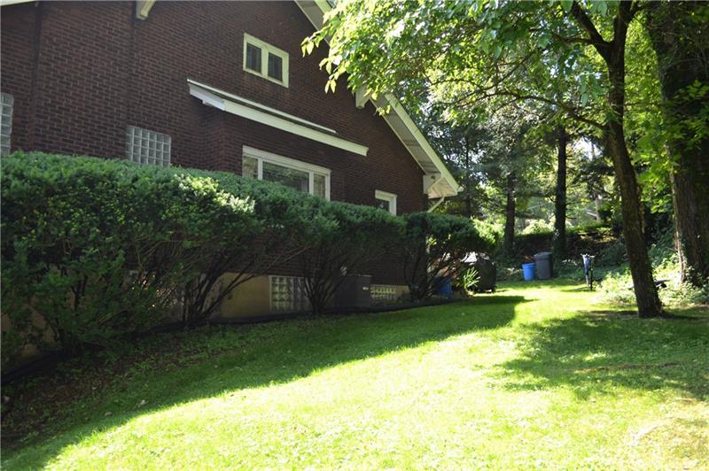 408 Cascade Road Pittsburgh, PA 15221 - Photo 5 of 25 The generous corner lot of this lovely brick Dutch style home is accented by mature trees that provide plenty of shade and natural beauty!