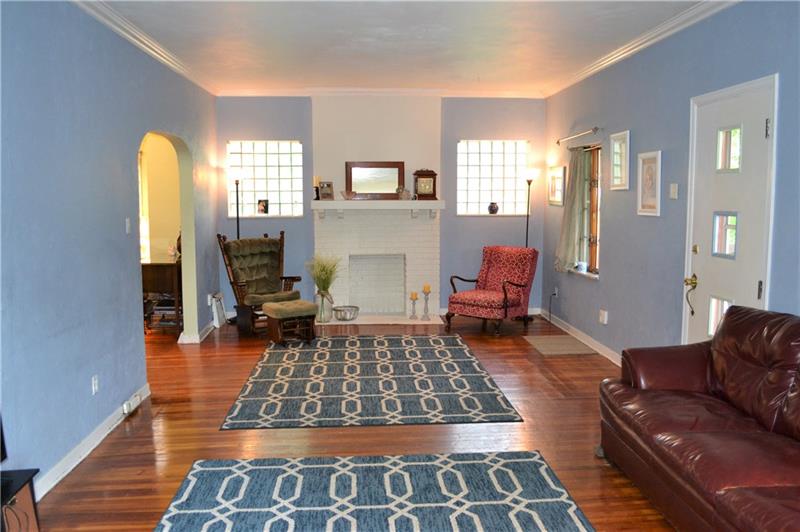 408 Cascade Road Pittsburgh, PA 15221 - Photo 7 of 25 You will love the extra large living room that greets you upon entry--filled with natural light from THREE walls of windows, and highlighted by gleaming original hardwoods refurbished by the current owners. The decorative fireplace is the focal point of this inviting space...
