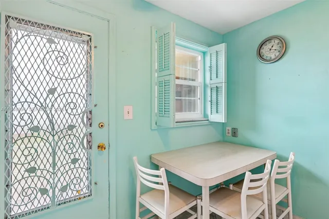a dining room with a table and a window