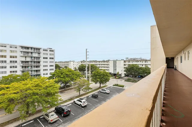 a view of balcony with furniture