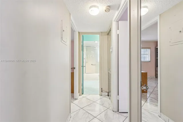 a view of a bathroom with a glass door