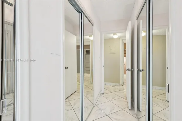 a bathroom with a glass shower door and a glass door