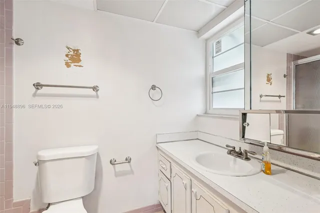 a bathroom with a sink and a toilet