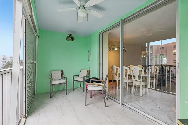 a view of room with furniture and windows