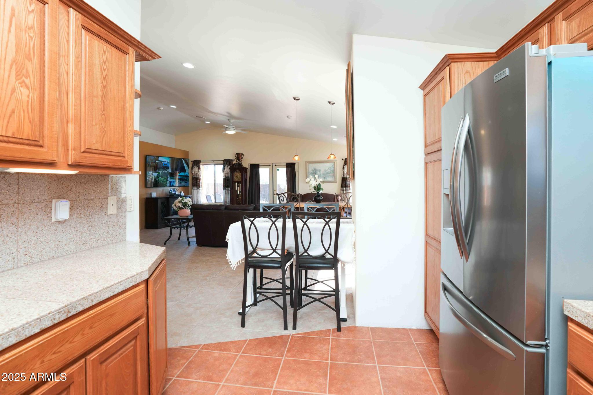 5775 North Kramer Drive Rimrock, AZ 86335 - Photo 12 of 33 a kitchen with stainless steel appliances granite countertop a refrigerator and a sink
