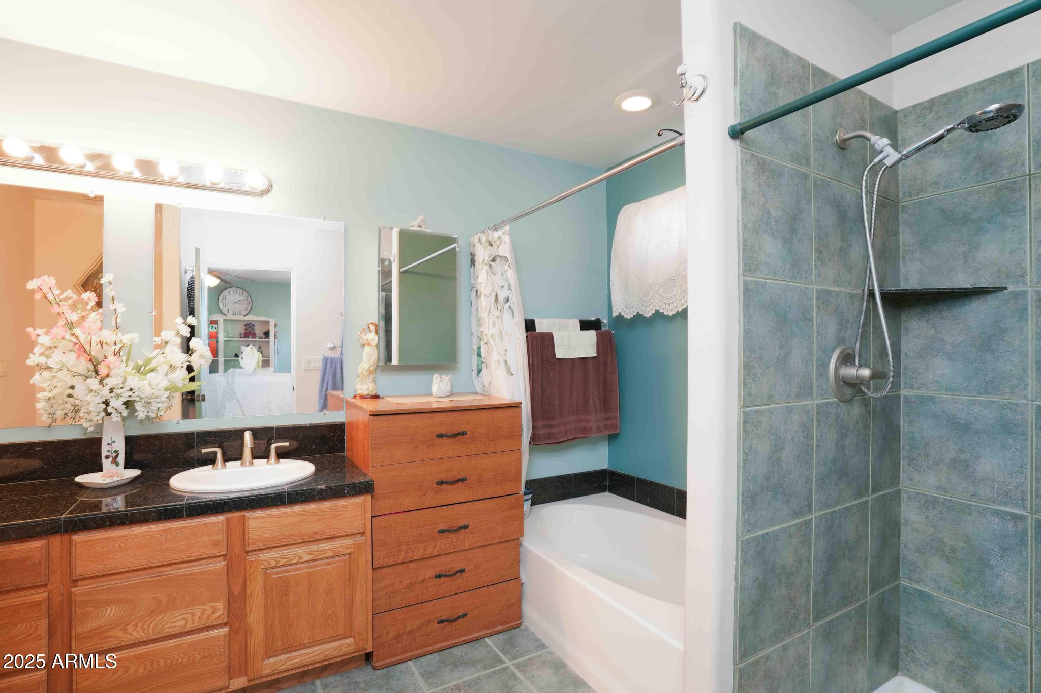 5775 North Kramer Drive Rimrock, AZ 86335 - Photo 17 of 33 a bathroom with a double sink shower two mirror and a shower