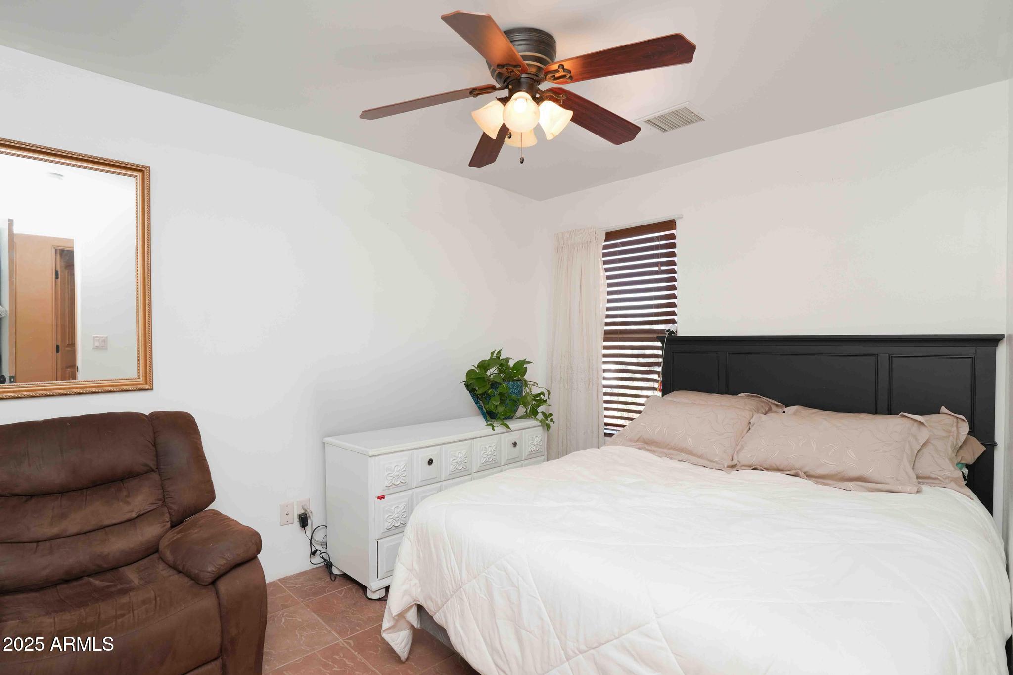 5775 North Kramer Drive Rimrock, AZ 86335 - Photo 20 of 33 a bedroom with a bed couch and a window