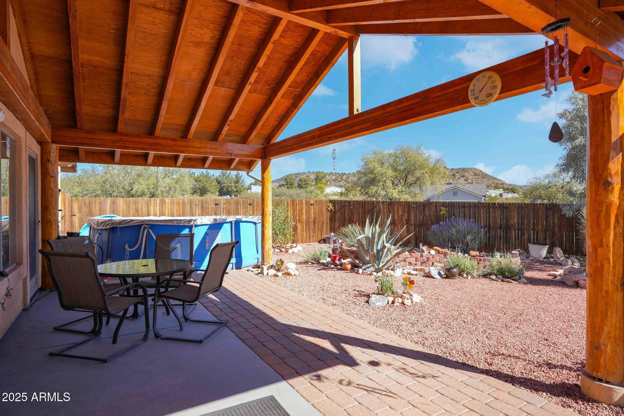 5775 North Kramer Drive Rimrock, AZ 86335 - Photo 27 of 33 a view of a patio with a table chairs and a patio