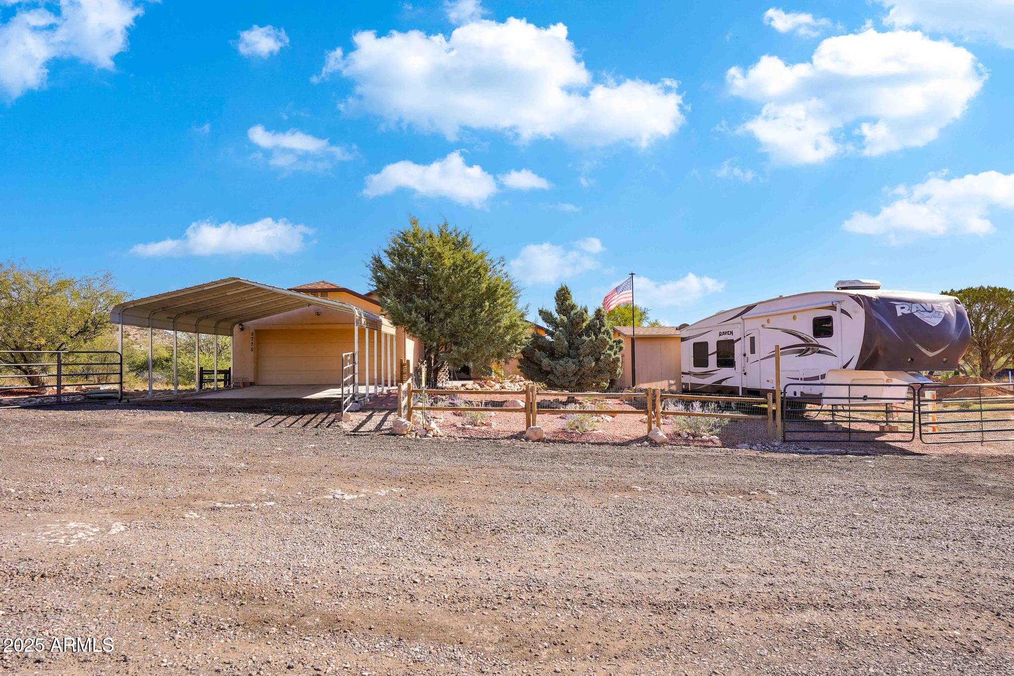 5775 North Kramer Drive Rimrock, AZ 86335 - Photo 33 of 33 a view of a house with a yard and sitting area