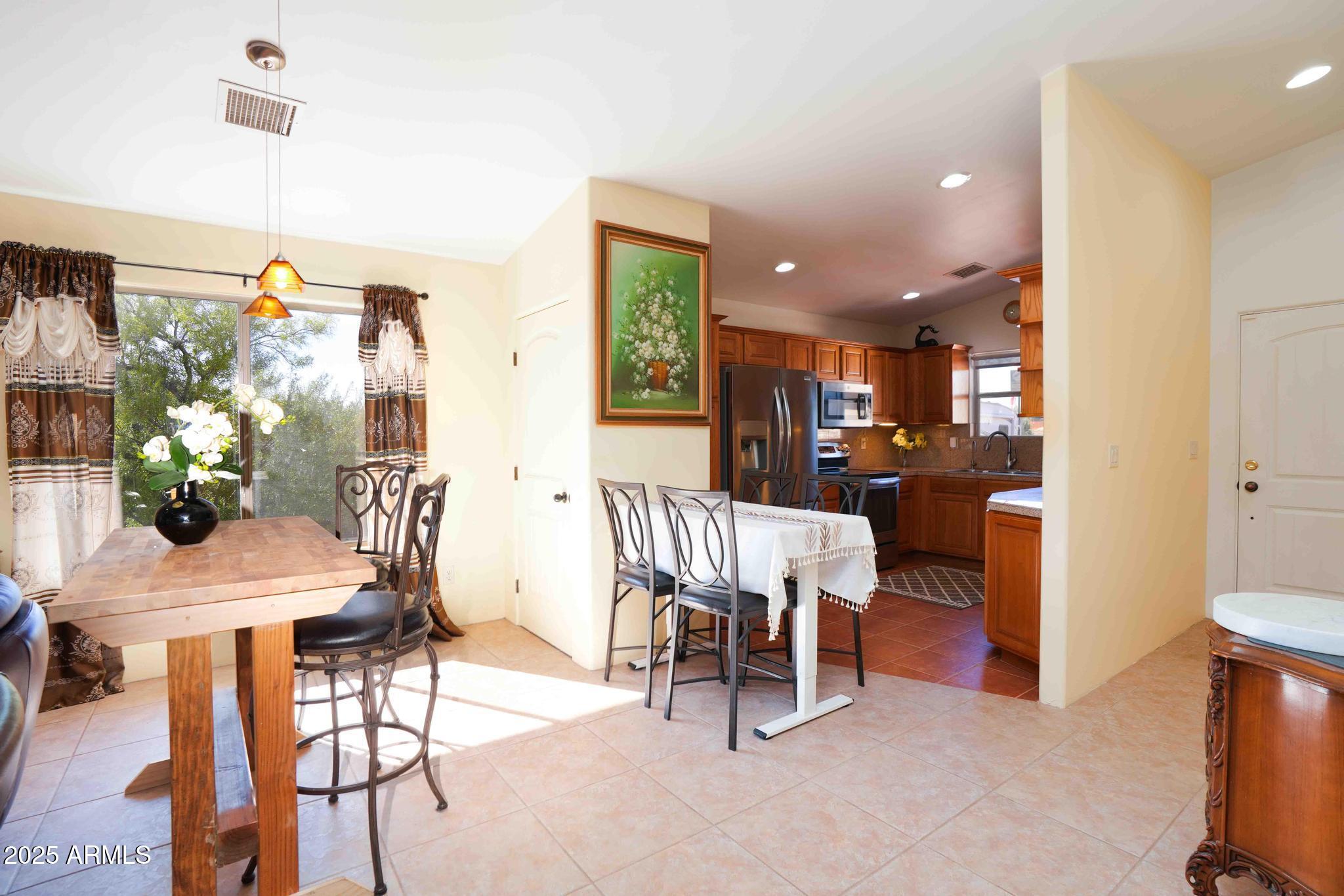 5775 North Kramer Drive Rimrock, AZ 86335 - Photo 9 of 33 a dining room with furniture and a potted plant