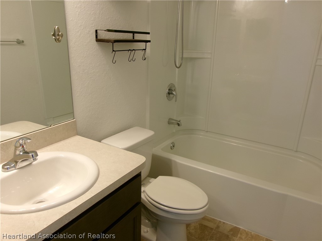 512 Central Ridge Lane Frostproof, FL 33843 - Photo 16 of 19 a bathroom with a sink and a toilet