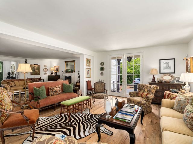 a kitchen with granite countertop a sink stove and refrigerator