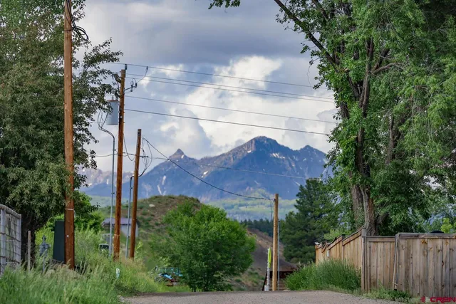 a view of house with an outdoor space and seating