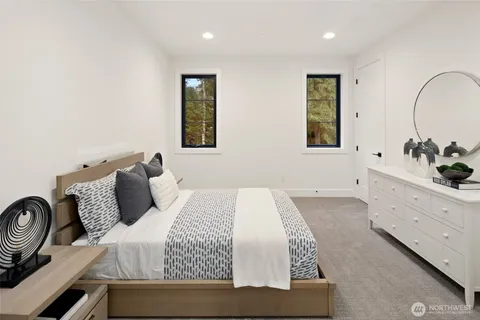 a bedroom with a bed and a couch