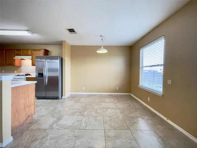 a view of a kitchen with a sink and a window