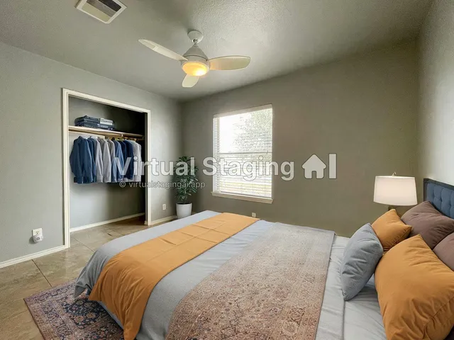 a bedroom with a bed and dresser