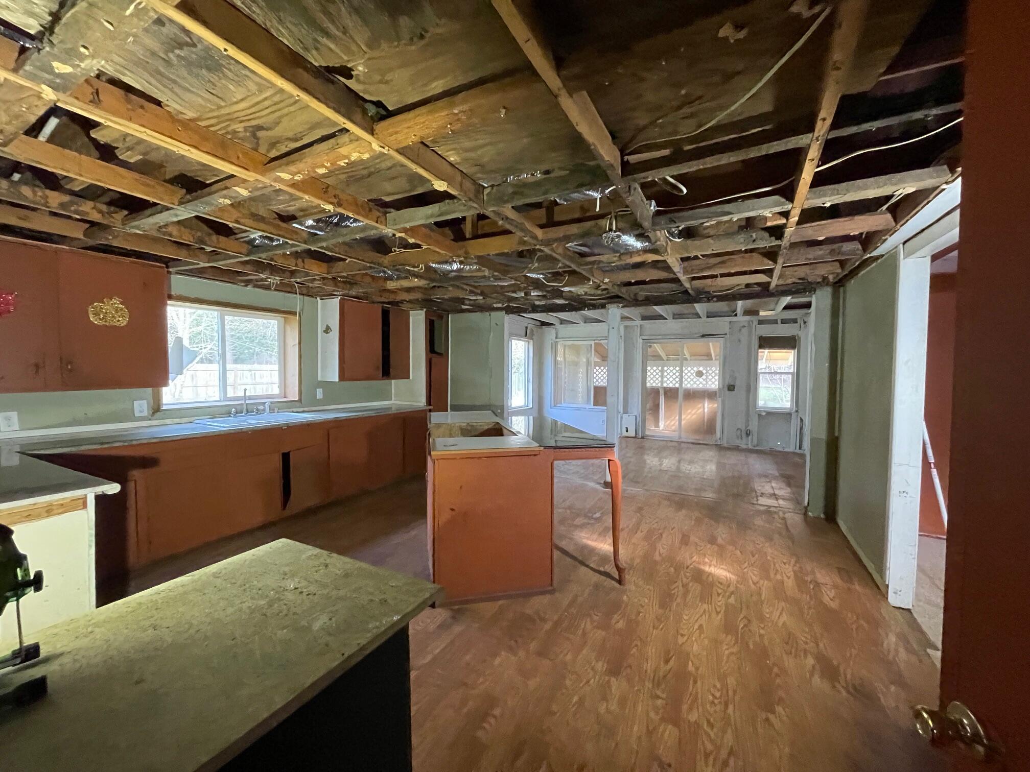 411 South Old Stage Road Cave Junction, OR 97523 - Photo 10 of 39 a view of a room with wooden furniture