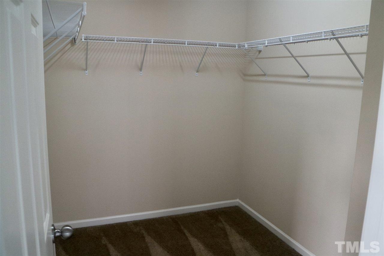 408 Provincial Street Raleigh, NC 27603 - Photo 10 of 24 a view of a room with racks on the wall
