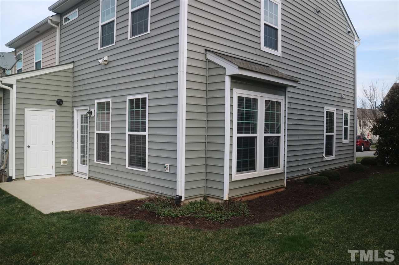 408 Provincial Street Raleigh, NC 27603 - Photo 15 of 24 a front view of a house with a garden