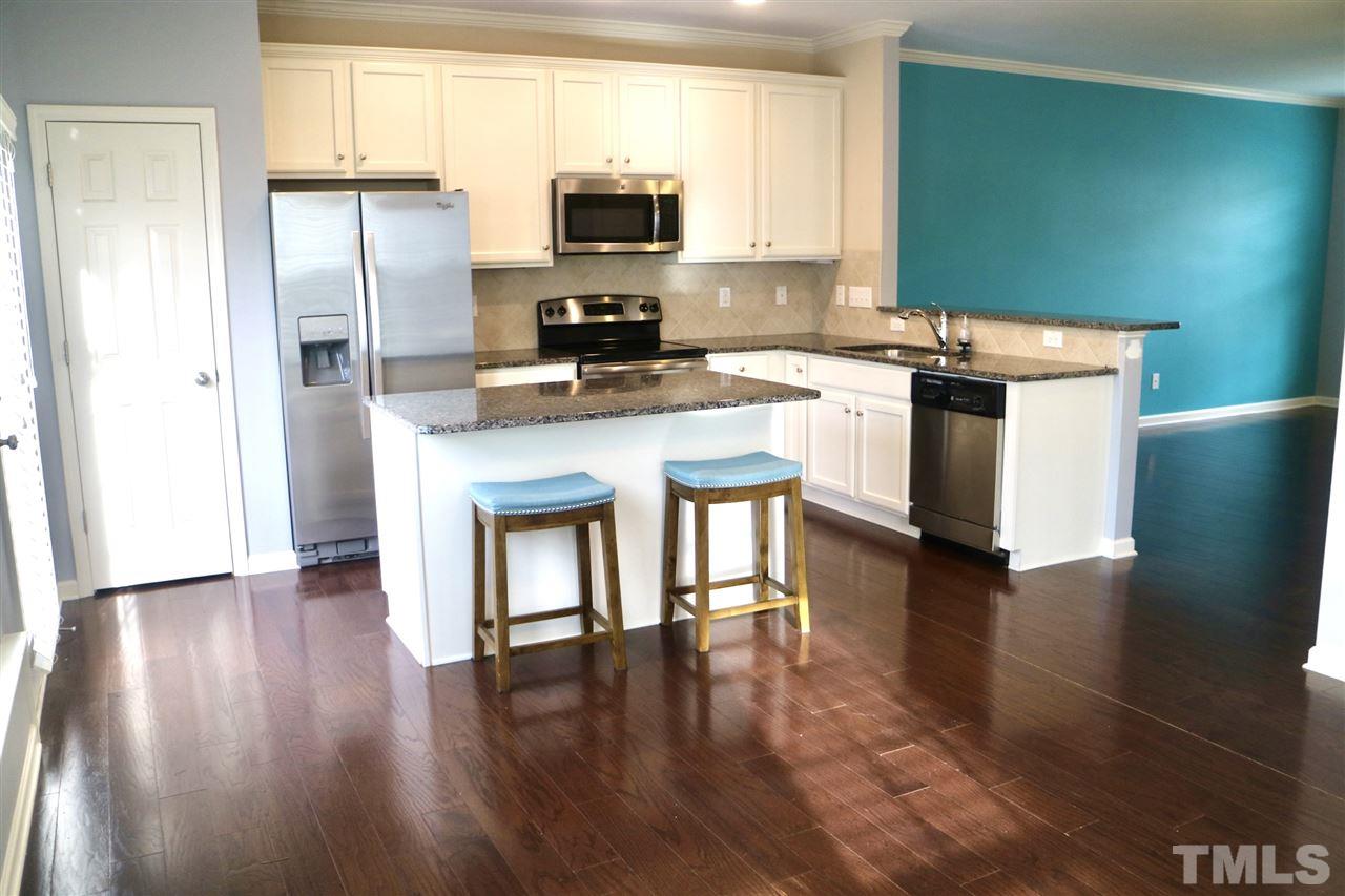 408 Provincial Street Raleigh, NC 27603 - Photo 24 of 24 a kitchen with stainless steel appliances a refrigerator stove microwave and sink