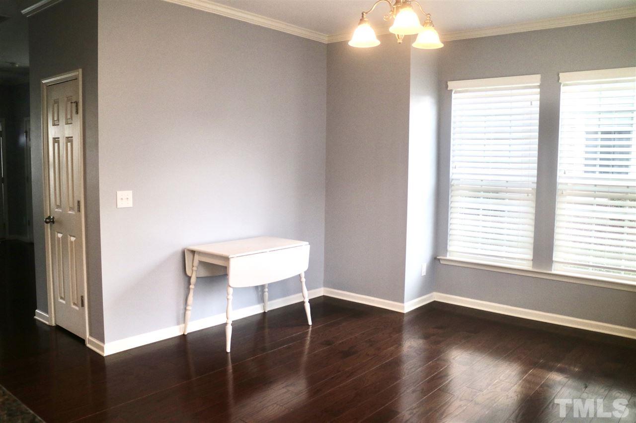 408 Provincial Street Raleigh, NC 27603 - Photo 7 of 24 a view of a room with wooden floor and a window